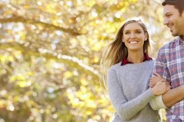 couple walking in woods